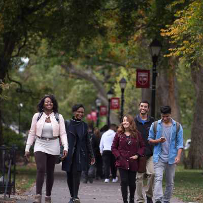 (L to R) Taylor Ebron-McQueen SAS'17, Chelsie Riche SAS'17, Mary Ortiz RBS'19, Sahil Vekaria RBS'20, and Savankumar Patel SAS'20 walk along Voorhees mall.